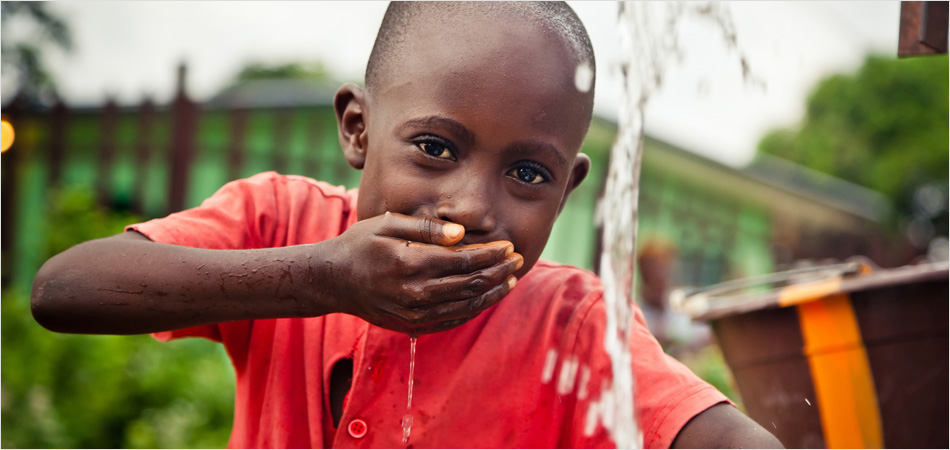 Child drinking from a clean water supply
