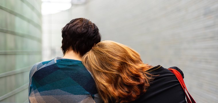 A woman resting her head on another person's shoulder - representing mental health. Photo by Külli Kittus on Unsplash