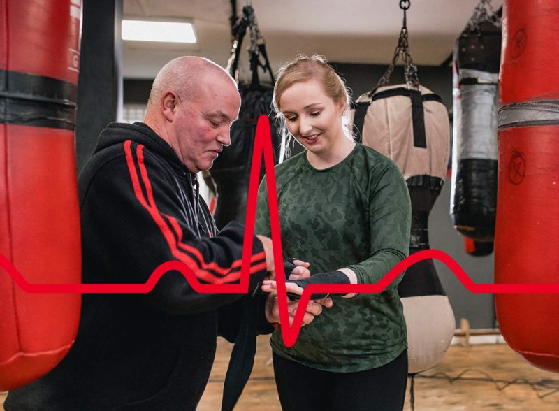 Brand image for Resuscitation Council UK showing a boxing instructor and his student