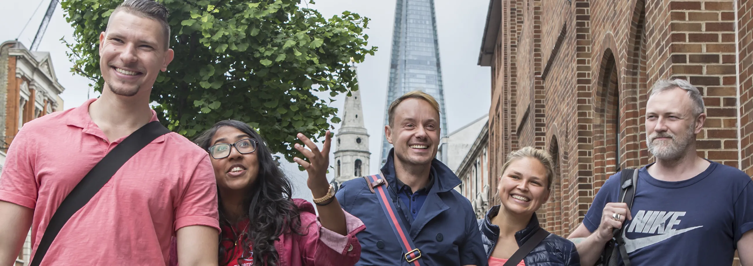 Photography commissioned as part of the rebrand – Students from the University College of Osteopathy walking along the street in London, with the Shard behind them 